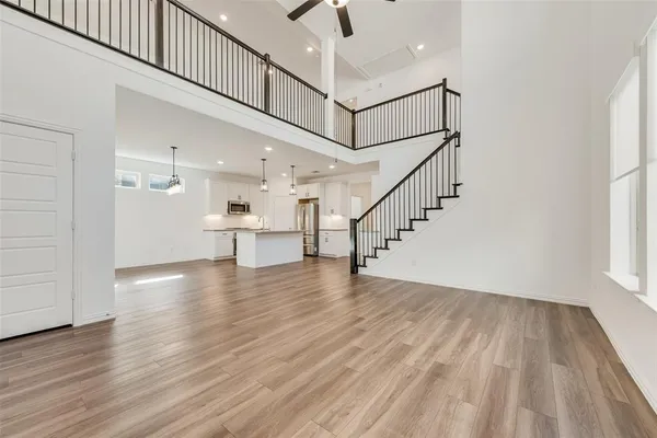 a view of entryway and hall with wooden floor