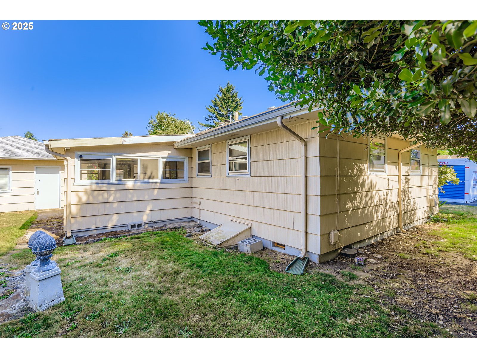 14031 Southeast Rhone Street Portland, OR 97236 - Photo 25 of 29 a view of backyard with a garden and deck