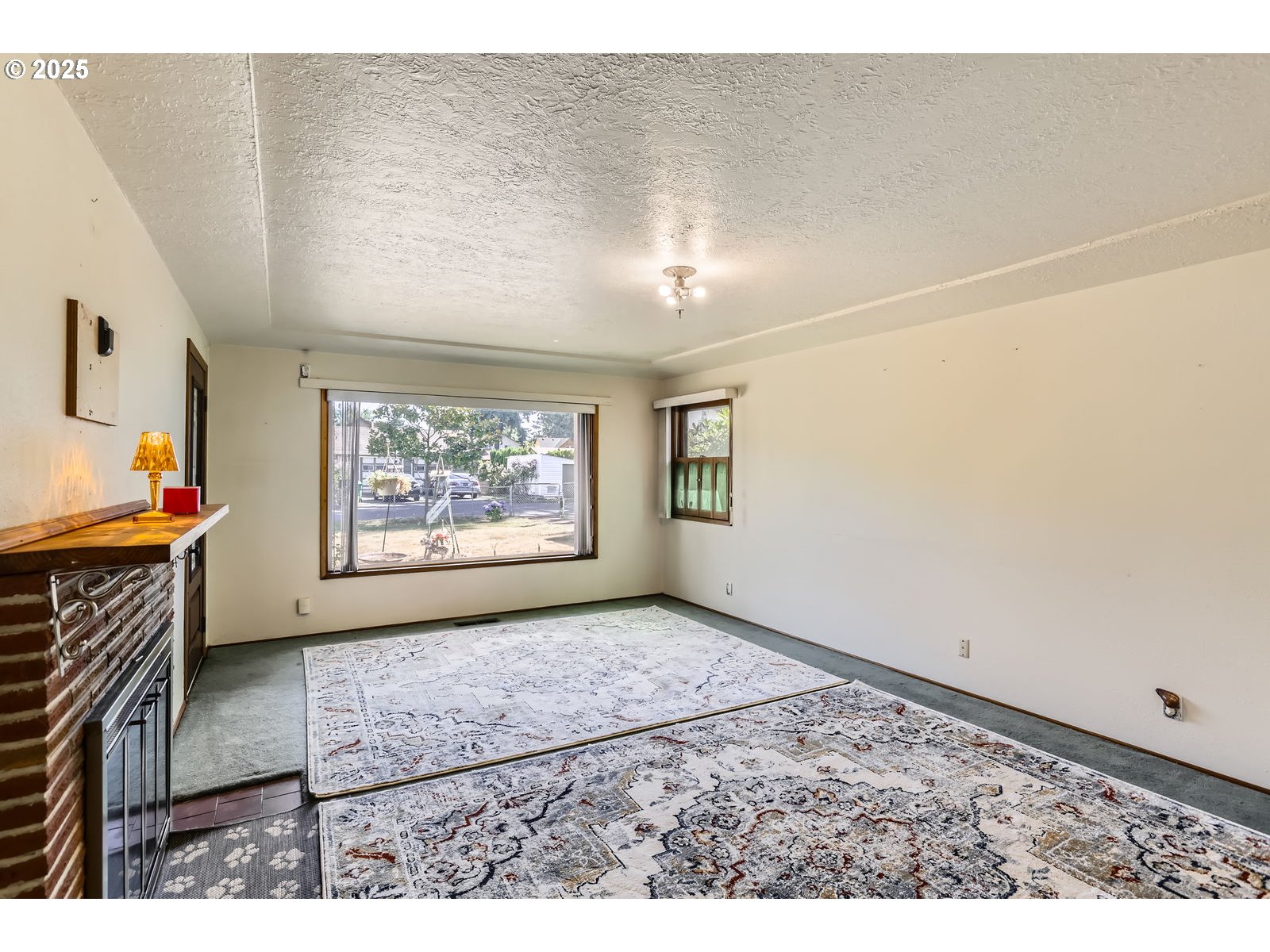 14031 Southeast Rhone Street Portland, OR 97236 - Photo 7 of 29 a view of an empty room with a window