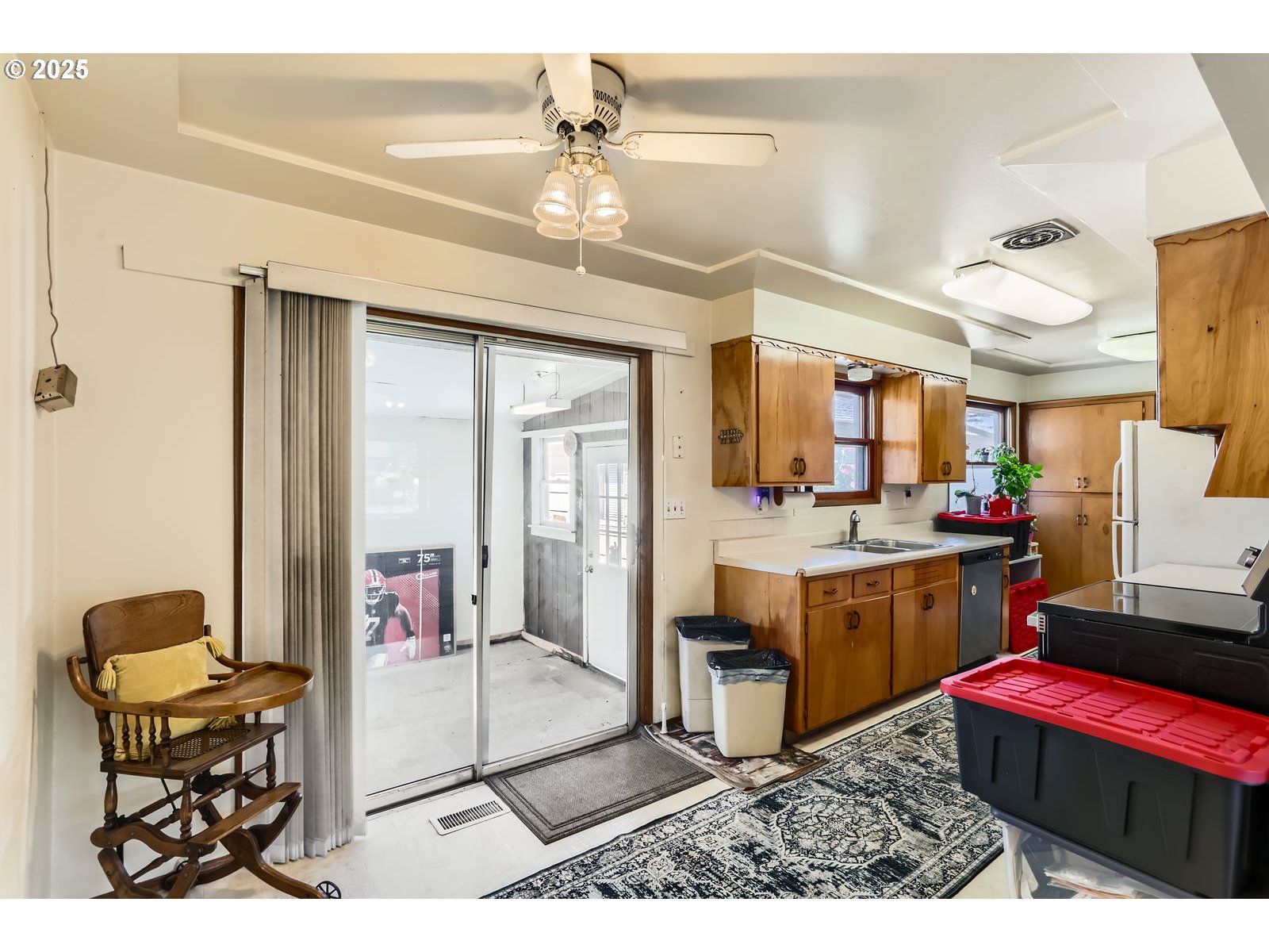 14031 Southeast Rhone Street Portland, OR 97236 - Photo 10 of 29 a living room with furniture a rug and white walls