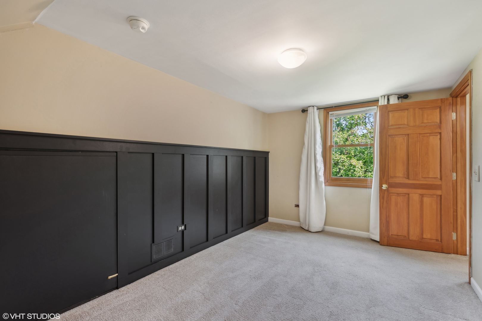 502 Raffel Road Woodstock, IL 60098 - Photo 13 of 24 a view of a closet with wooden floor and windows