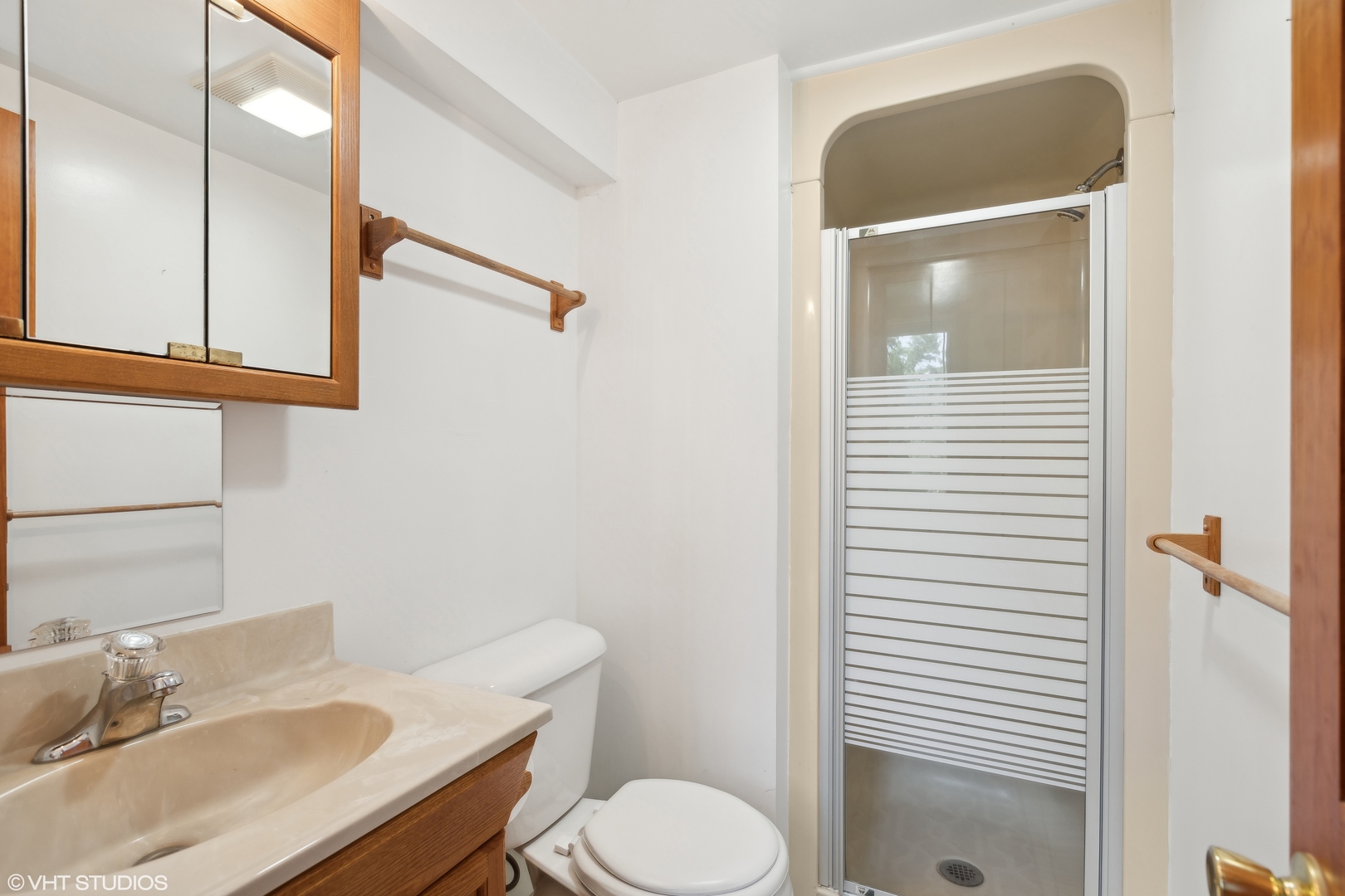 502 Raffel Road Woodstock, IL 60098 - Photo 15 of 24 a bathroom with a sink toilet and vanity