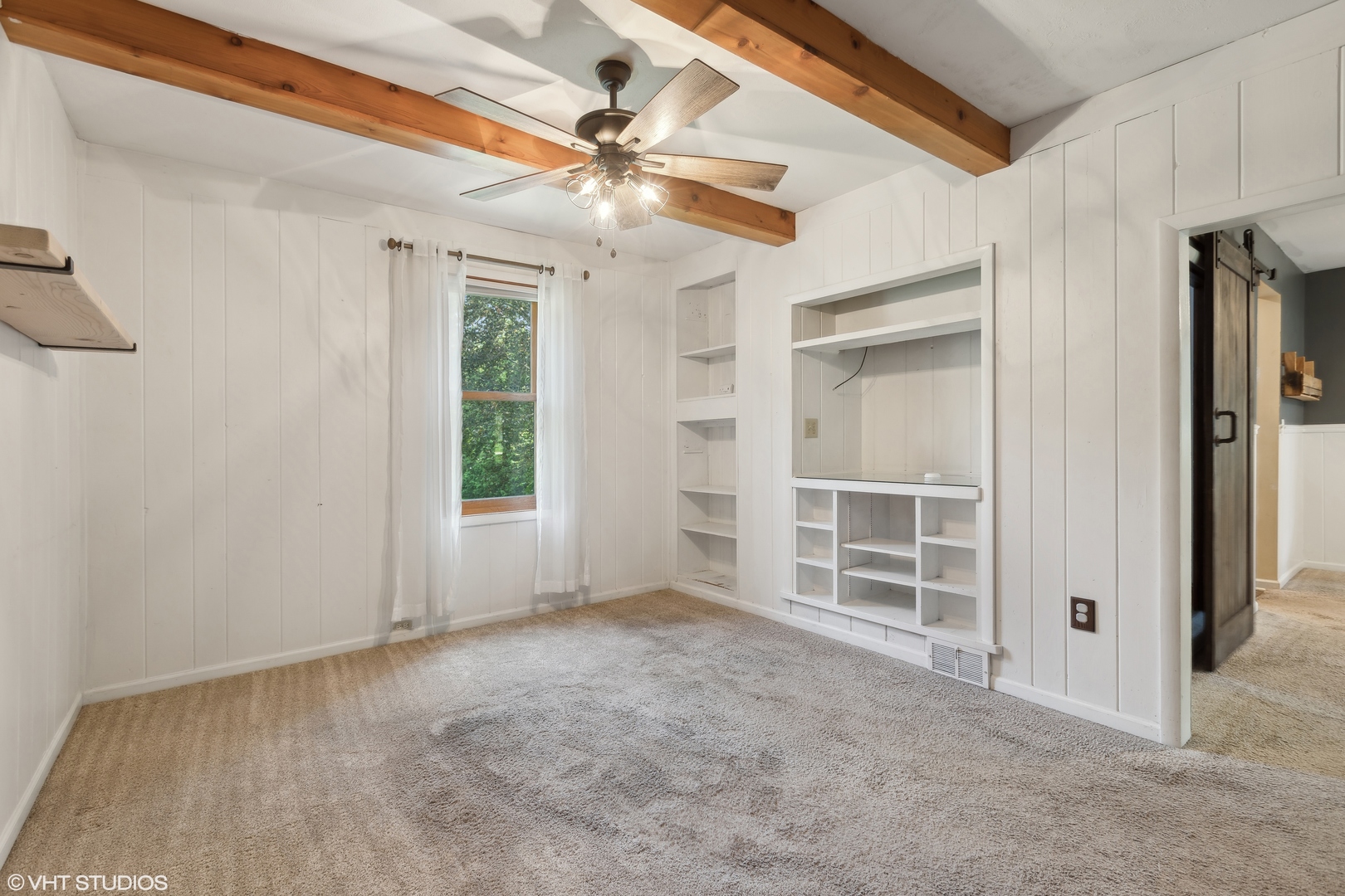 502 Raffel Road Woodstock, IL 60098 - Photo 7 of 24 a view of an empty room with a window