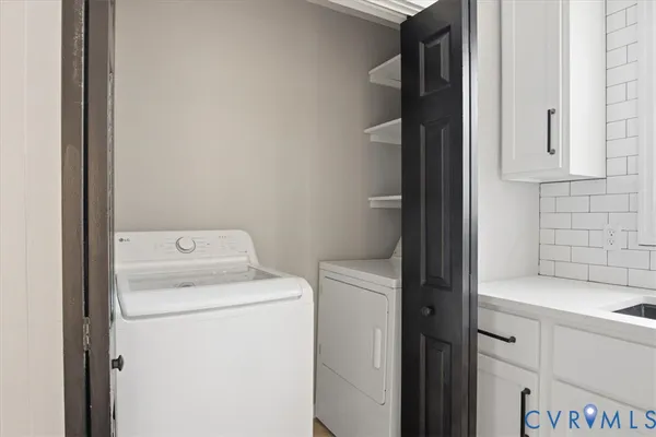 a utility room with dryer and washer