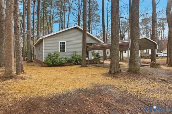 a view of a house with backyard and balcony