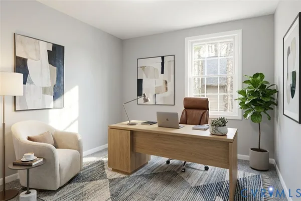 a work room with furniture and a potted plant