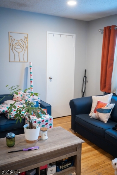 37 Espy Road, Unit 6B Caldwell, NJ 07006 - Photo 11 of 20 a dining room with furniture and wooden floor