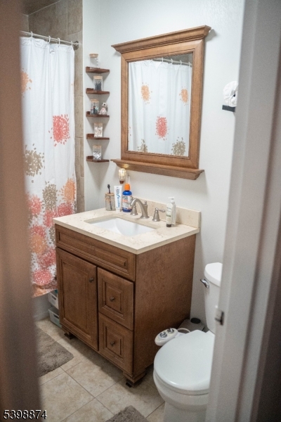37 Espy Road, Unit 6B Caldwell, NJ 07006 - Photo 12 of 20 a bathroom with a sink vanity mirror and toilet