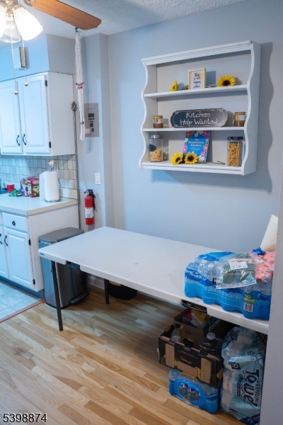 37 Espy Road, Unit 6B Caldwell, NJ 07006 - Photo 19 of 20 a room with furniture and wooden floor