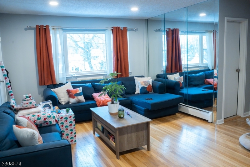 37 Espy Road, Unit 6B Caldwell, NJ 07006 - Photo 20 of 20 a living room with furniture and wooden floor