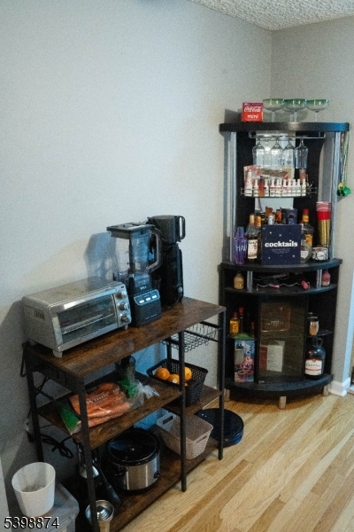 37 Espy Road, Unit 6B Caldwell, NJ 07006 - Photo 3 of 20 a room with furniture and wooden floor