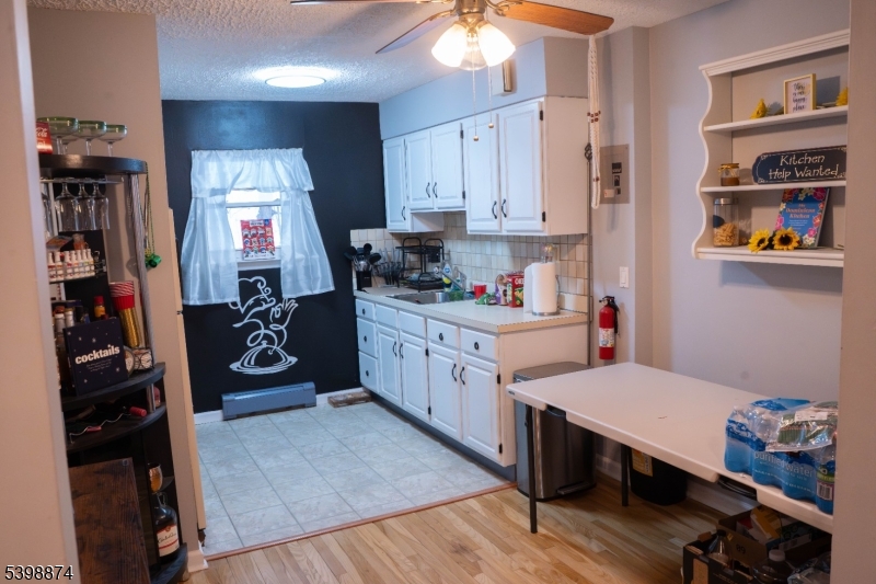 37 Espy Road, Unit 6B Caldwell, NJ 07006 - Photo 4 of 20 a kitchen with a sink cabinets and window