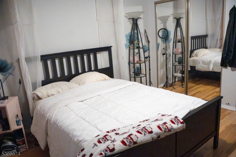 37 Espy Road, Unit 6B Caldwell, NJ 07006 - Photo 8 of 20 a bed sitting in a bedroom next to a window