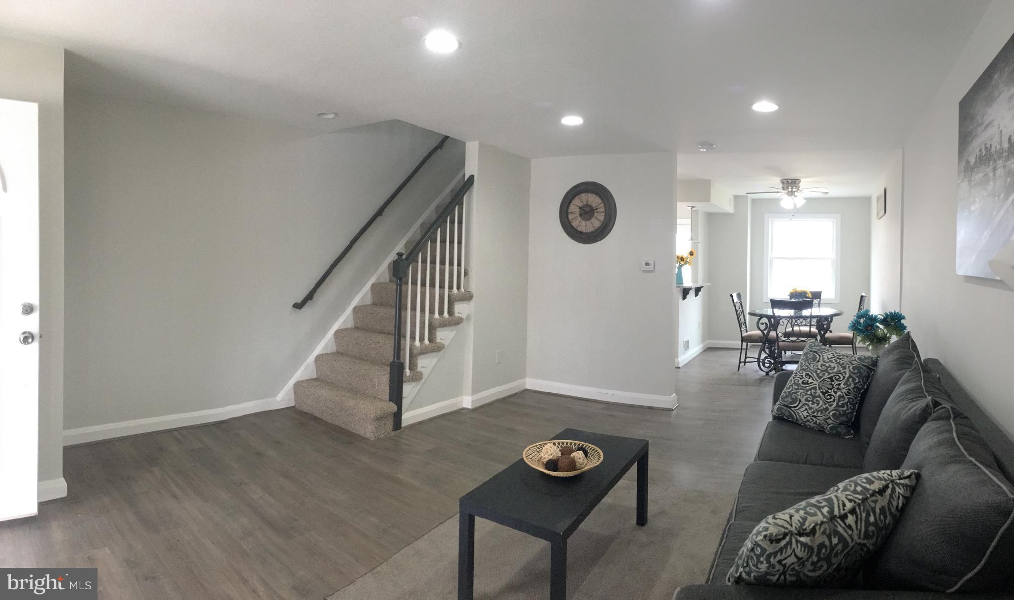 7968 Kavanagh Road Baltimore, MD 21222 - Photo 2 of 30 a living room with furniture and a wooden floor