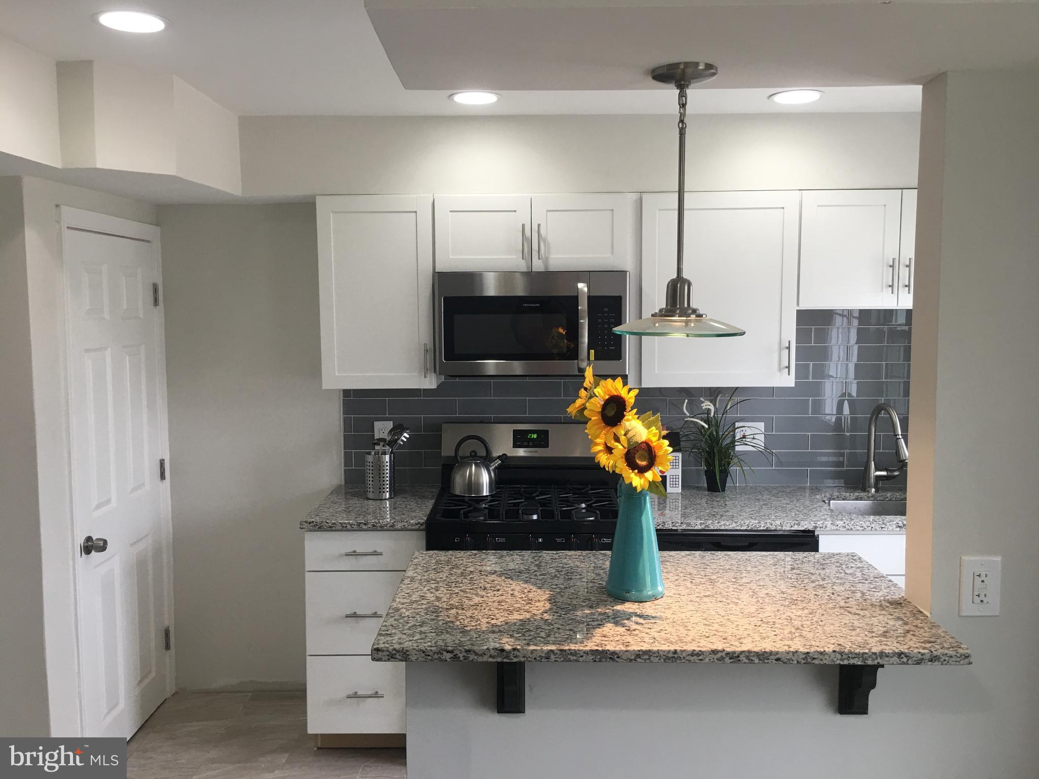 7968 Kavanagh Road Baltimore, MD 21222 - Photo 13 of 30 a kitchen with counter top space appliances and cabinets