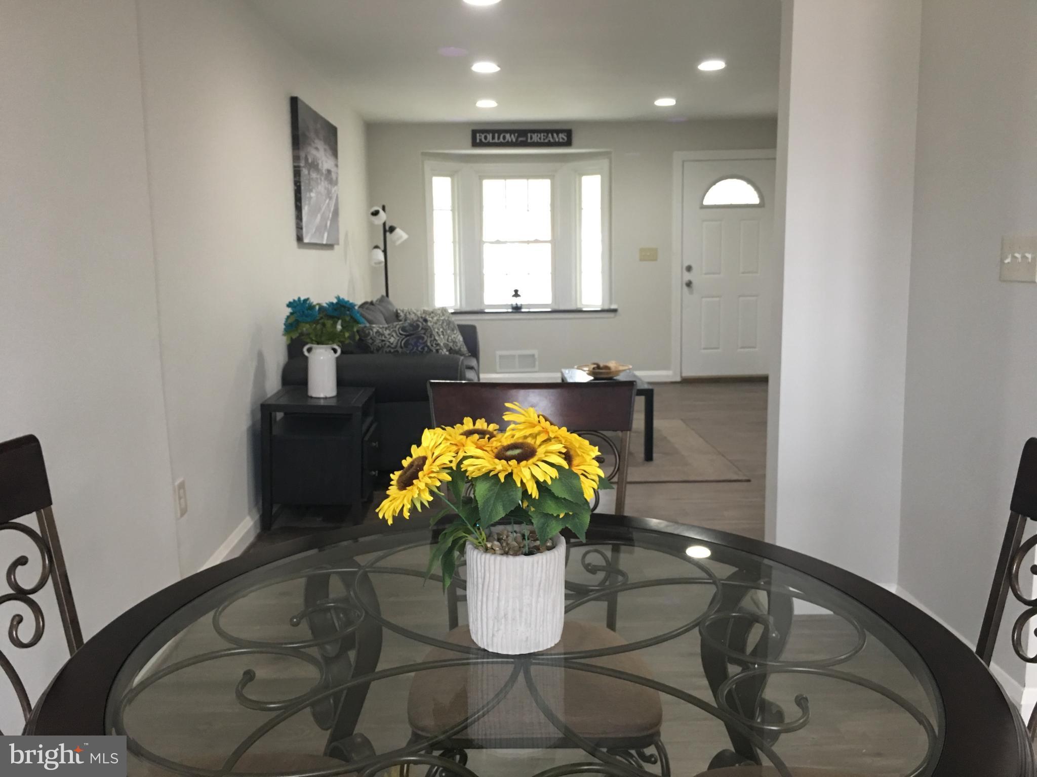 7968 Kavanagh Road Baltimore, MD 21222 - Photo 17 of 30 a vase of flowers sitting on a table