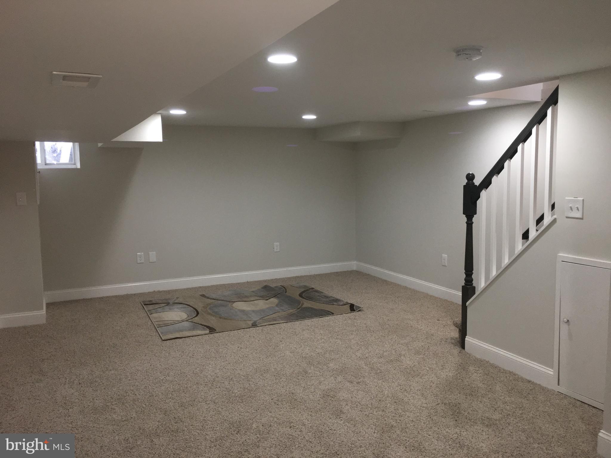 7968 Kavanagh Road Baltimore, MD 21222 - Photo 22 of 30 a view of a room with stairs and white walls