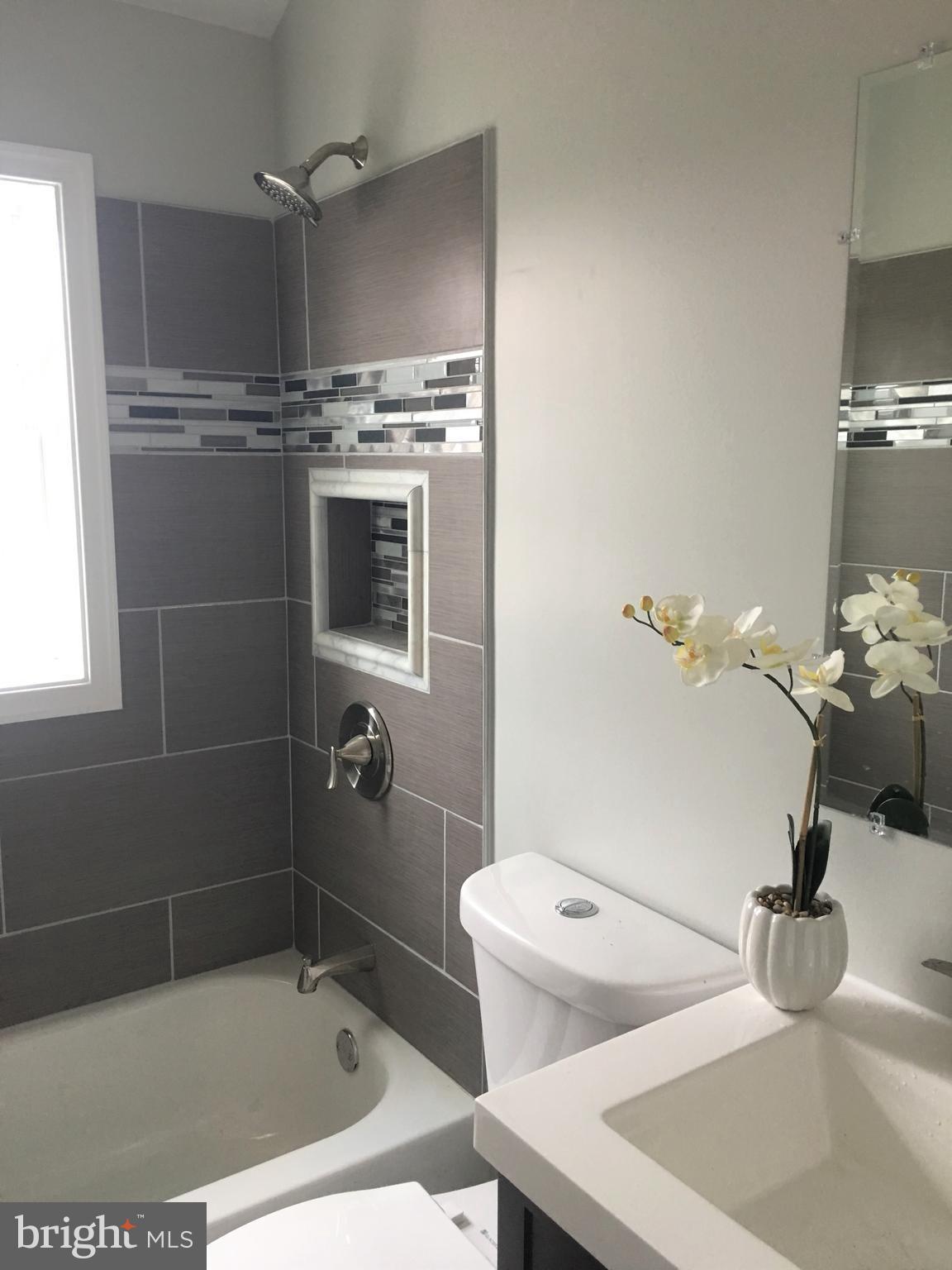 7968 Kavanagh Road Baltimore, MD 21222 - Photo 25 of 30 a bathroom with a sink a toilet and shower