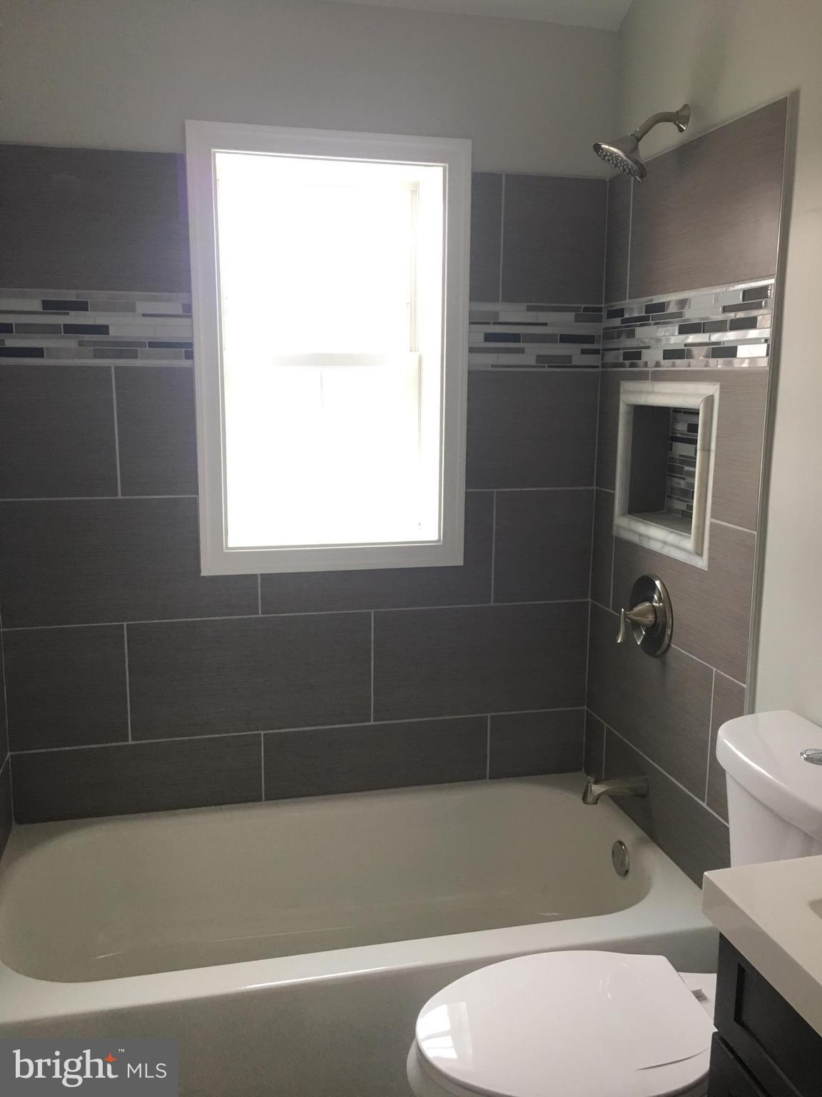 7968 Kavanagh Road Baltimore, MD 21222 - Photo 26 of 30 a bath tub sitting next to a toilet