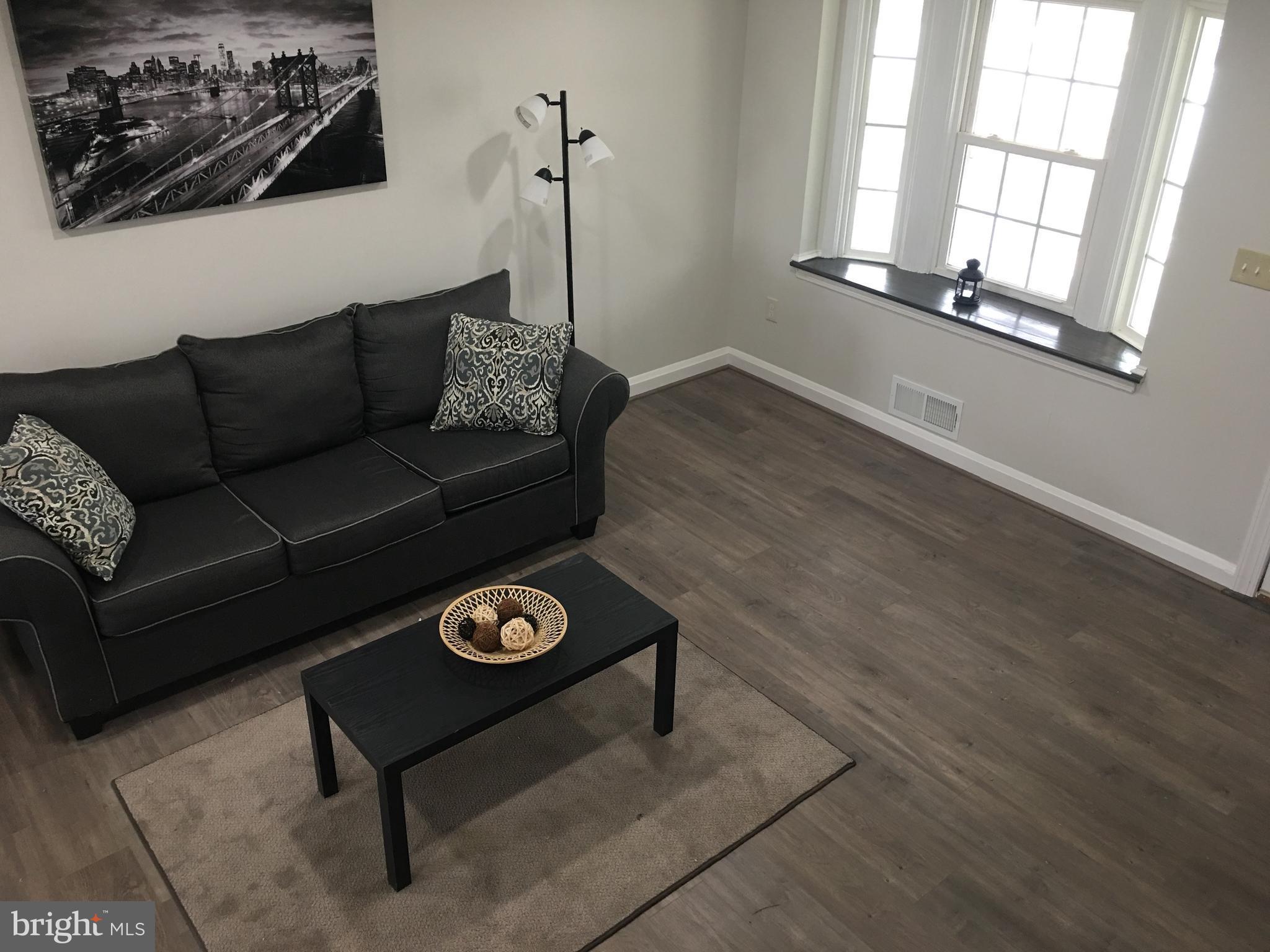 7968 Kavanagh Road Baltimore, MD 21222 - Photo 5 of 30 a living room with furniture and a window