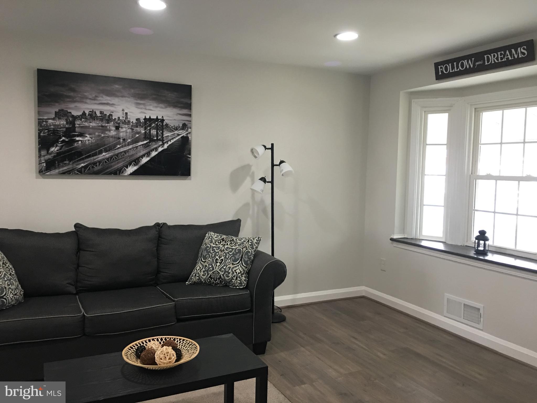 7968 Kavanagh Road Baltimore, MD 21222 - Photo 6 of 30 a living room with furniture and a window
