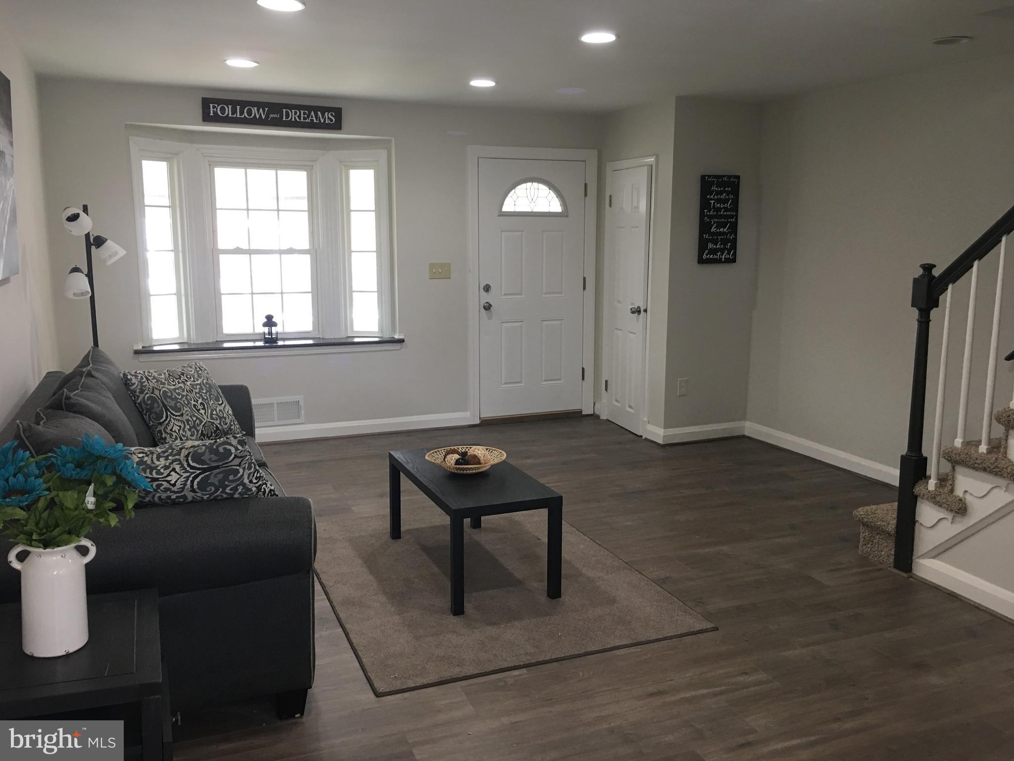 7968 Kavanagh Road Baltimore, MD 21222 - Photo 7 of 30 a living room with furniture and a window