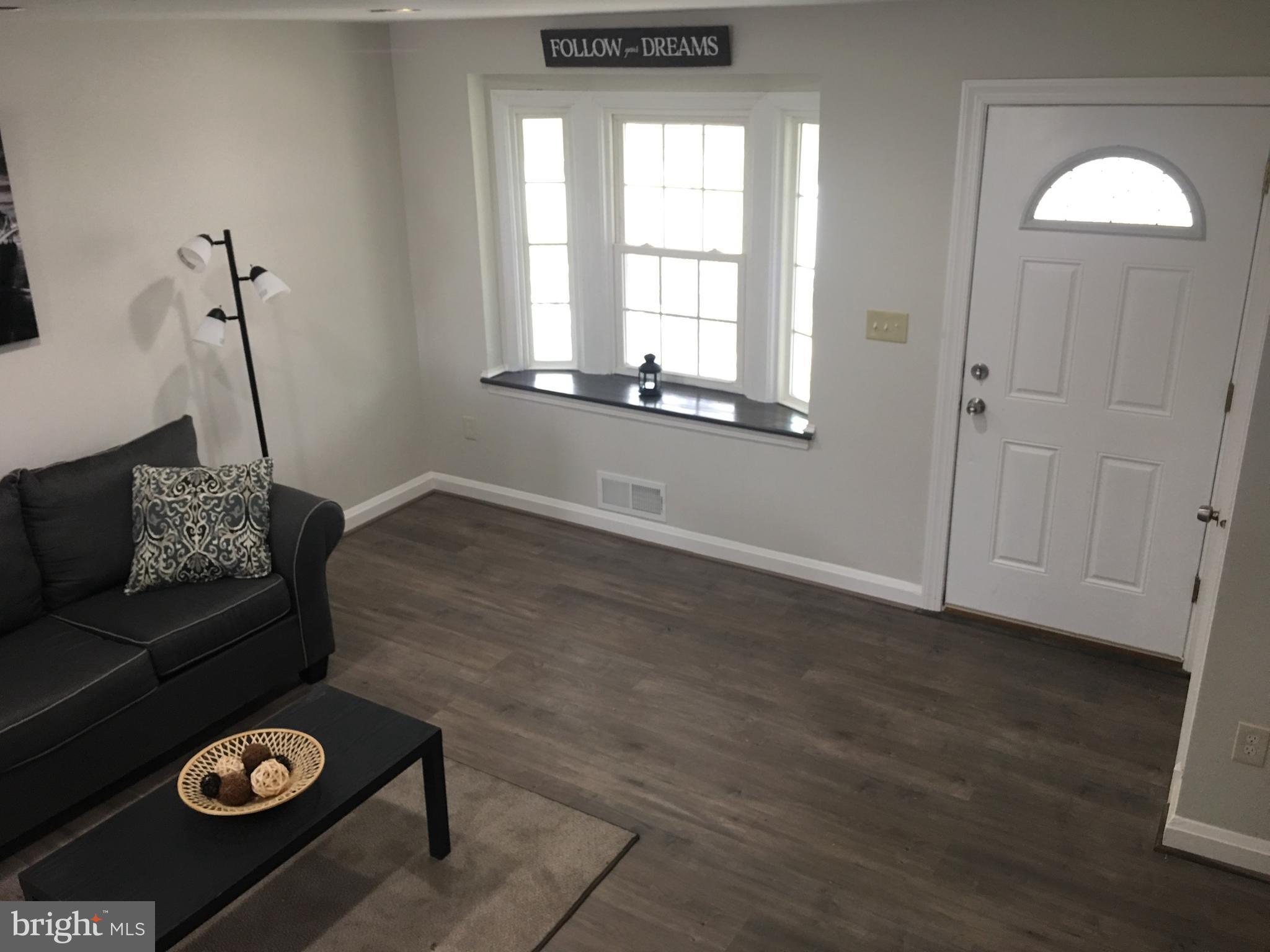 7968 Kavanagh Road Baltimore, MD 21222 - Photo 8 of 30 a living room with couch and a window