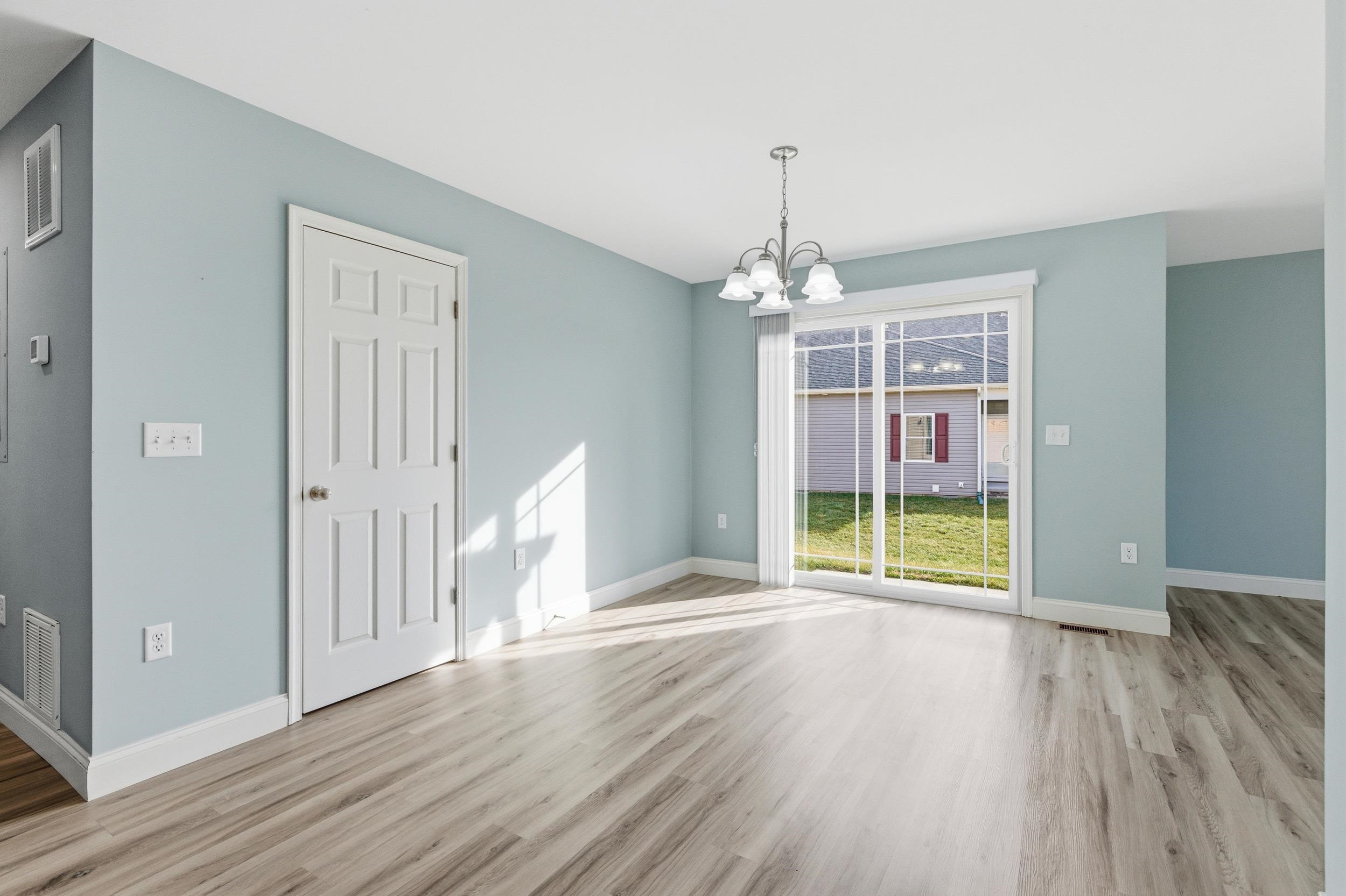 136 Millstone Street Bridgewater, VA 22812 - Photo 13 of 75 a view of an empty room with wooden floor and a window