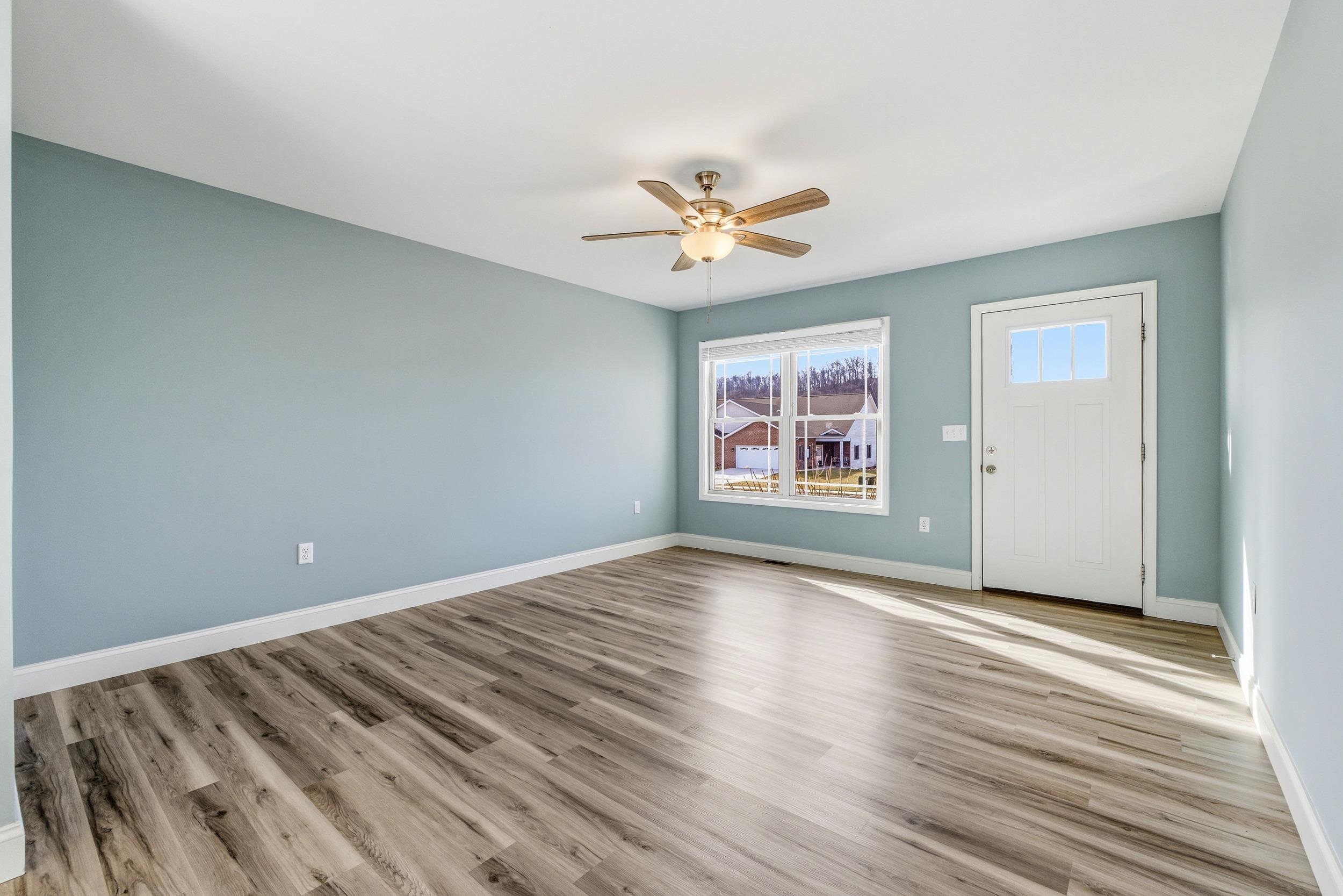 136 Millstone Street Bridgewater, VA 22812 - Photo 18 of 75 a view of an empty room with a window and wooden floor