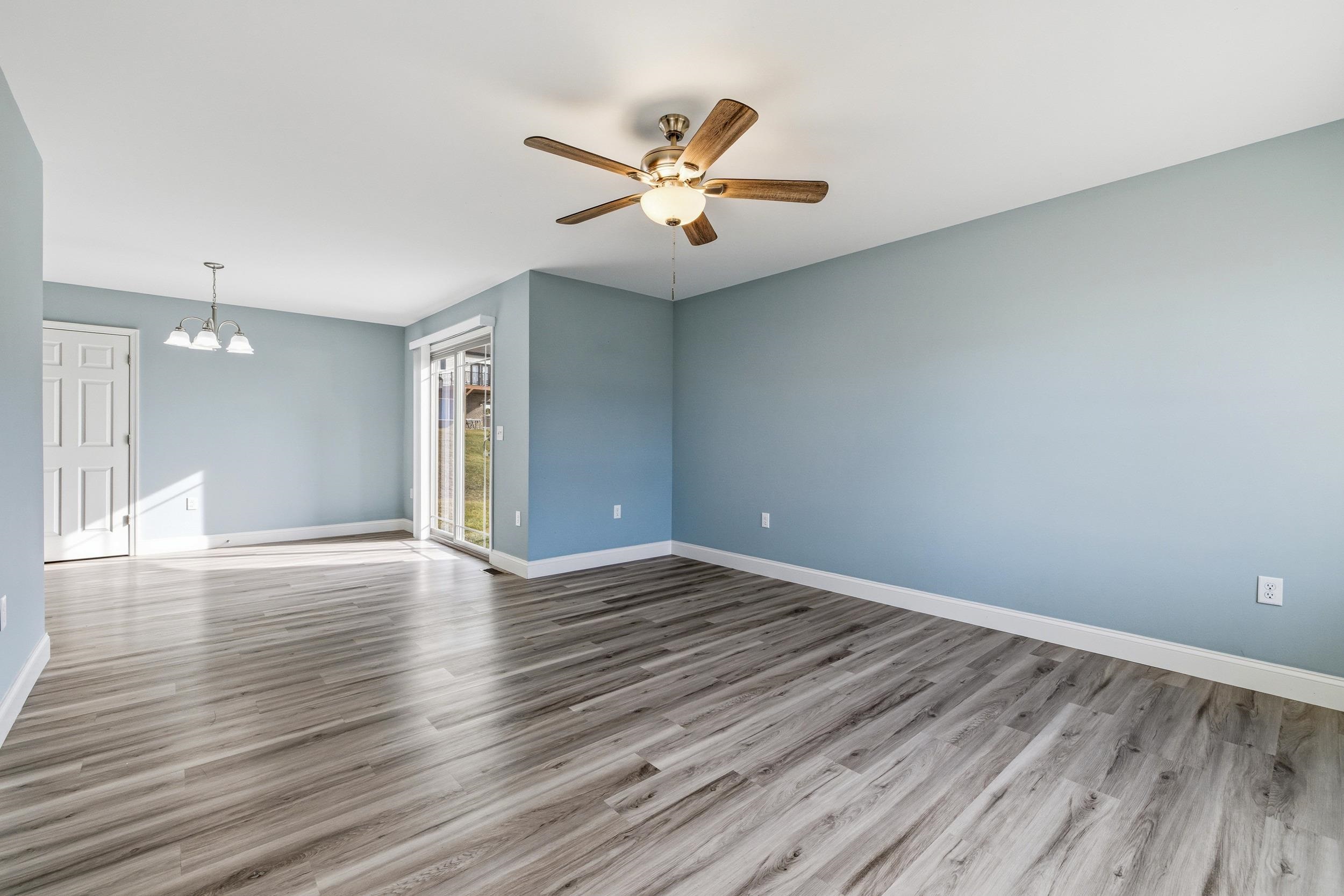 136 Millstone Street Bridgewater, VA 22812 - Photo 19 of 75 a view of an empty room with wooden floor and a ceiling fan