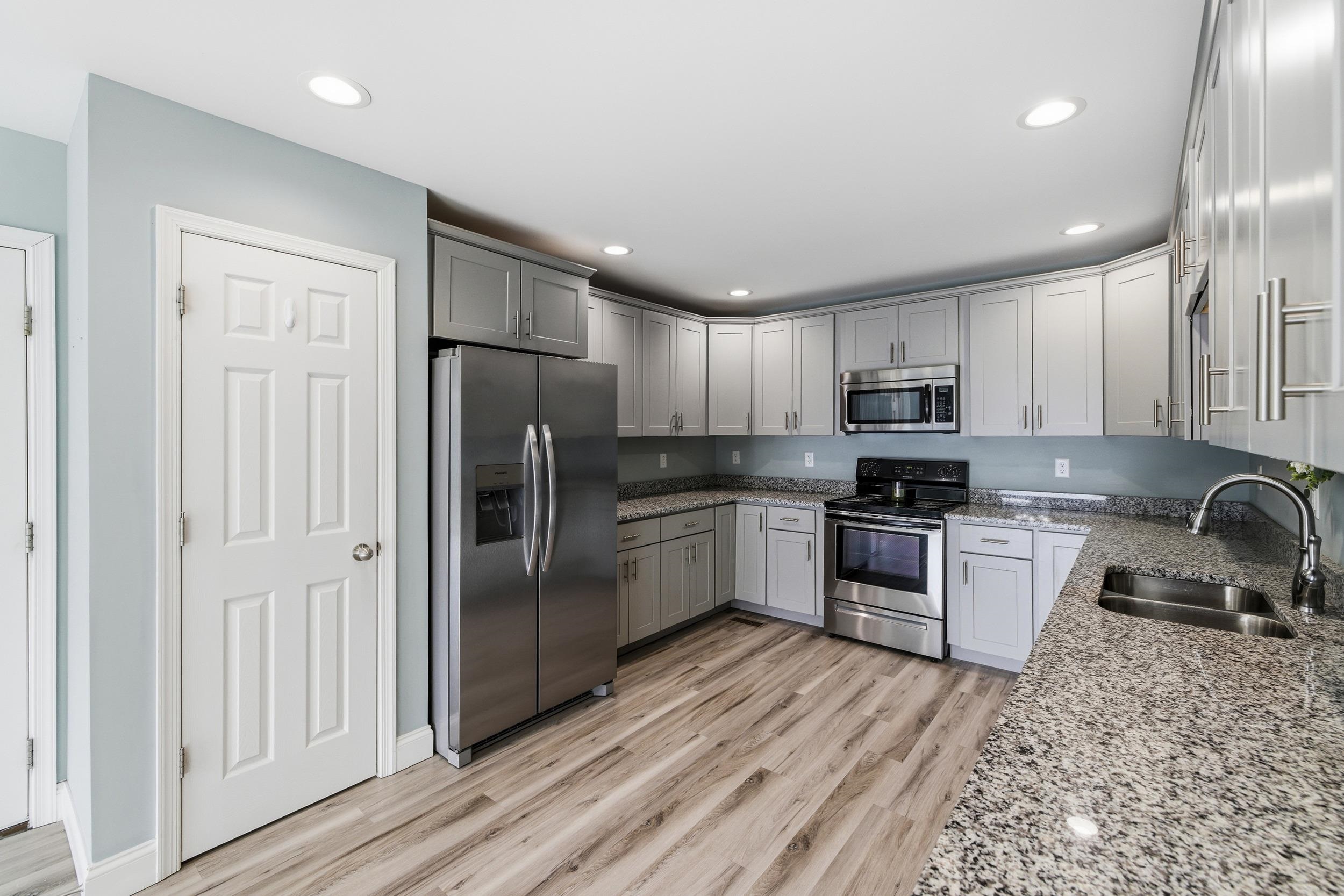 136 Millstone Street Bridgewater, VA 22812 - Photo 3 of 75 a kitchen with stainless steel appliances granite countertop a refrigerator a stove top oven a sink and dishwasher