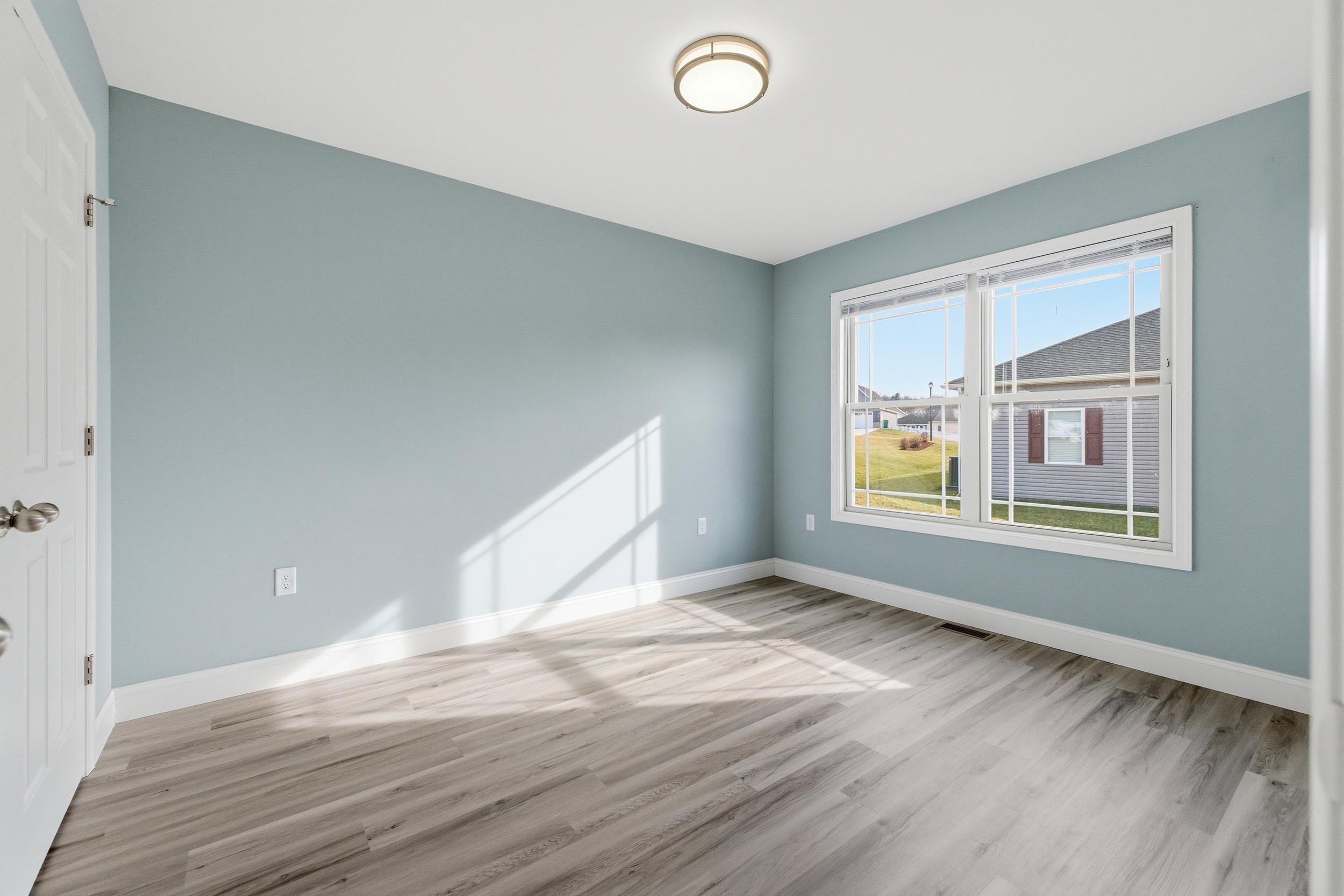 136 Millstone Street Bridgewater, VA 22812 - Photo 31 of 75 a view of an empty room with wooden floor and a window