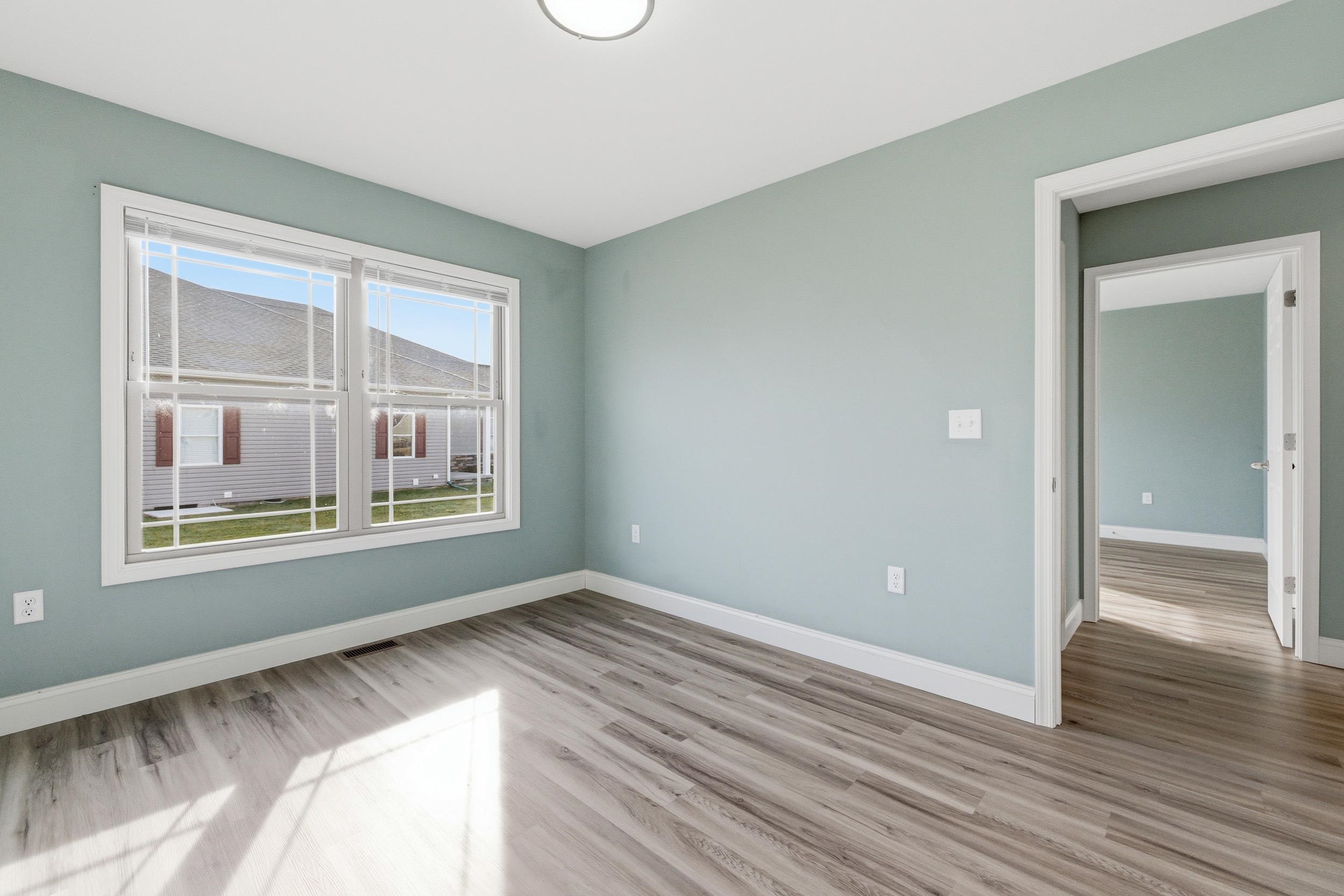 136 Millstone Street Bridgewater, VA 22812 - Photo 33 of 75 a view of an empty room with wooden floor and a window