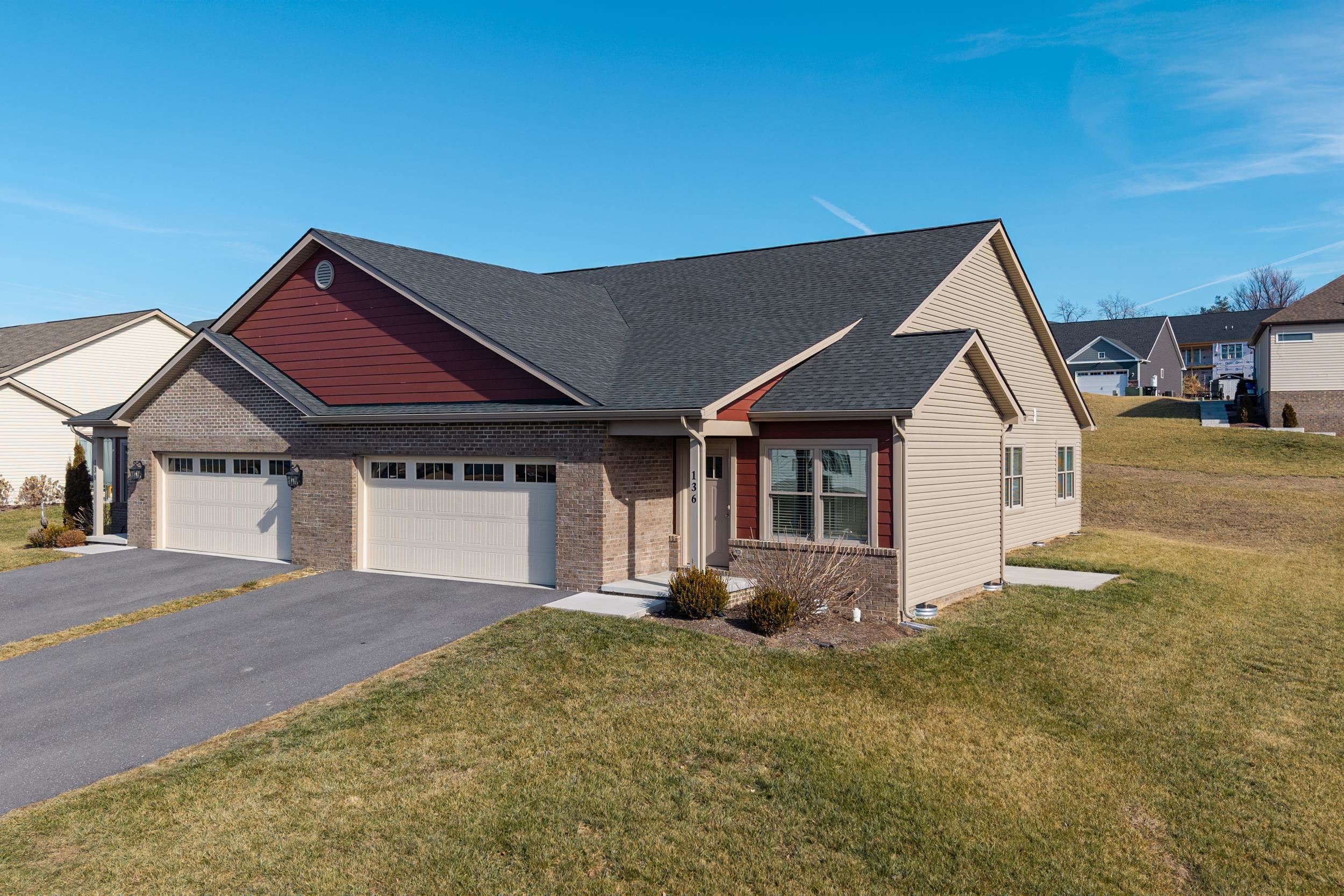 136 Millstone Street Bridgewater, VA 22812 - Photo 45 of 75 a front view of a house with a yard and garage