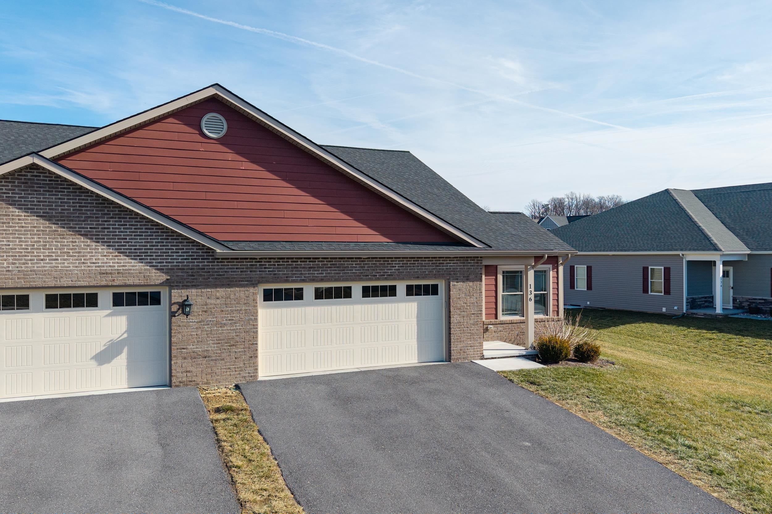 136 Millstone Street Bridgewater, VA 22812 - Photo 46 of 75 a front view of a house with a yard and garage