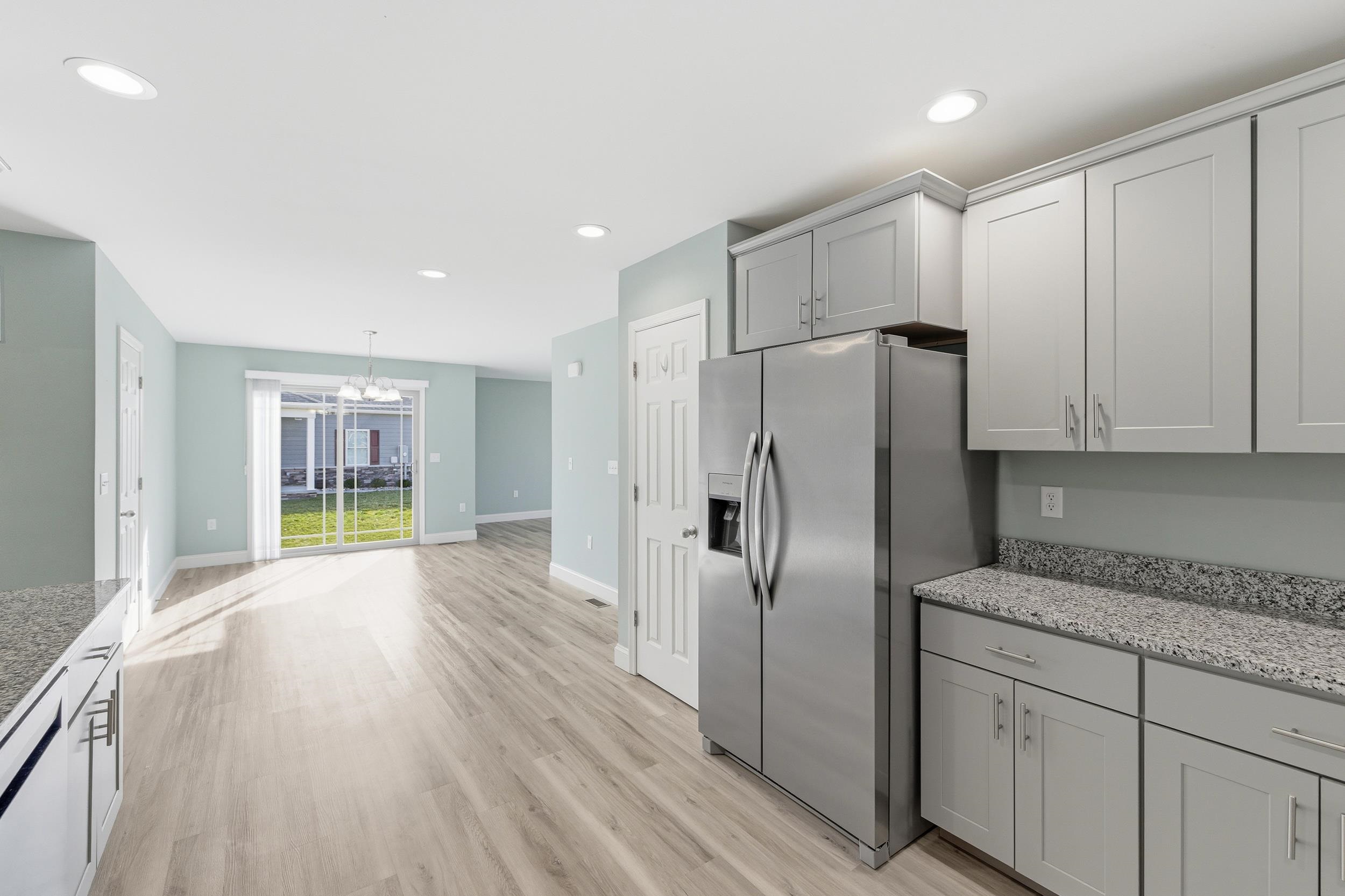 136 Millstone Street Bridgewater, VA 22812 - Photo 5 of 75 a kitchen with stainless steel appliances granite countertop a refrigerator sink and cabinets