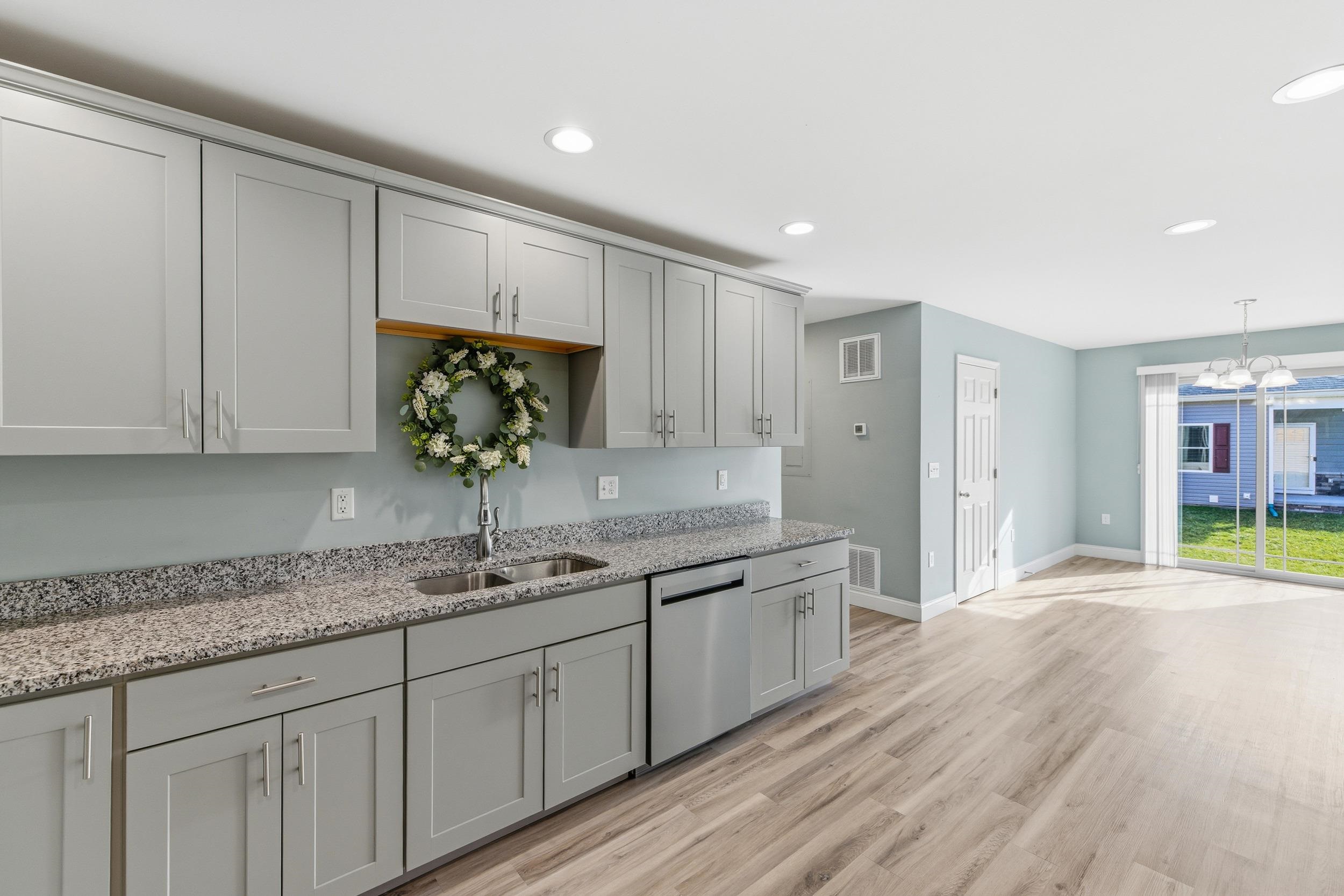 136 Millstone Street Bridgewater, VA 22812 - Photo 6 of 75 a kitchen with granite countertop a sink and cabinets