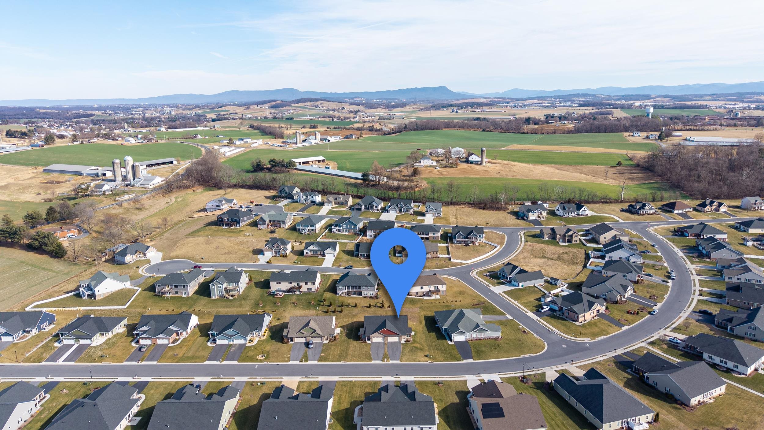 136 Millstone Street Bridgewater, VA 22812 - Photo 71 of 75 an aerial view of a city with lots of residential buildings ocean and mountain view in back