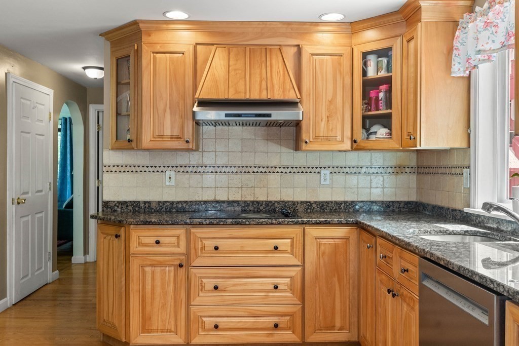 73 Baldwin Road Billerica, MA 01821 - Photo 11 of 40 a kitchen with granite countertop a sink and a window