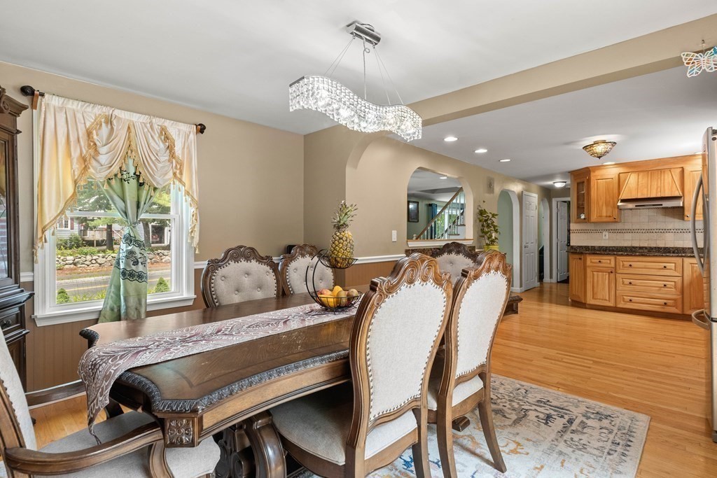 73 Baldwin Road Billerica, MA 01821 - Photo 12 of 40 a living room with furniture a chandelier and a large window