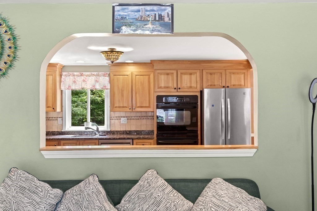 73 Baldwin Road Billerica, MA 01821 - Photo 14 of 40 a view of a livingroom with furniture and windows
