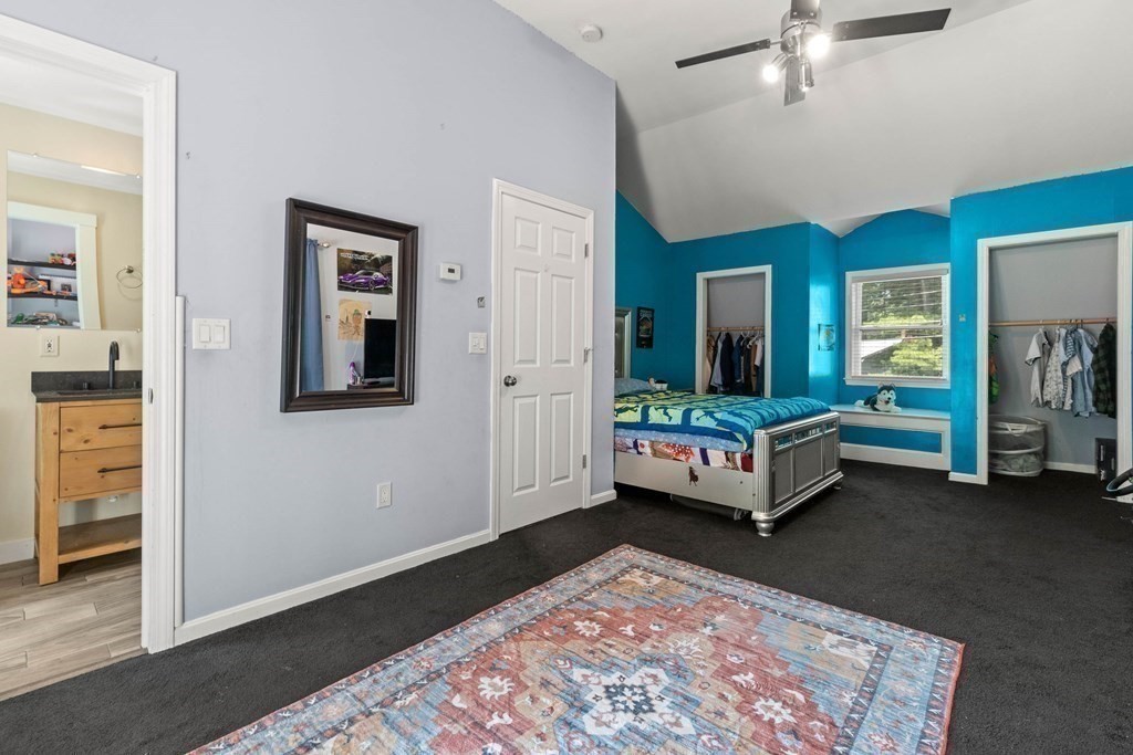 73 Baldwin Road Billerica, MA 01821 - Photo 18 of 40 a living room with furniture and a table
