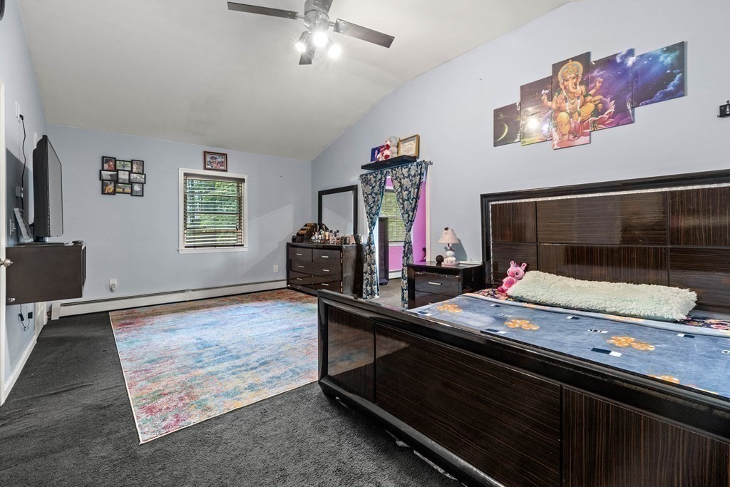 73 Baldwin Road Billerica, MA 01821 - Photo 21 of 40 a living room with furniture and a flat screen tv