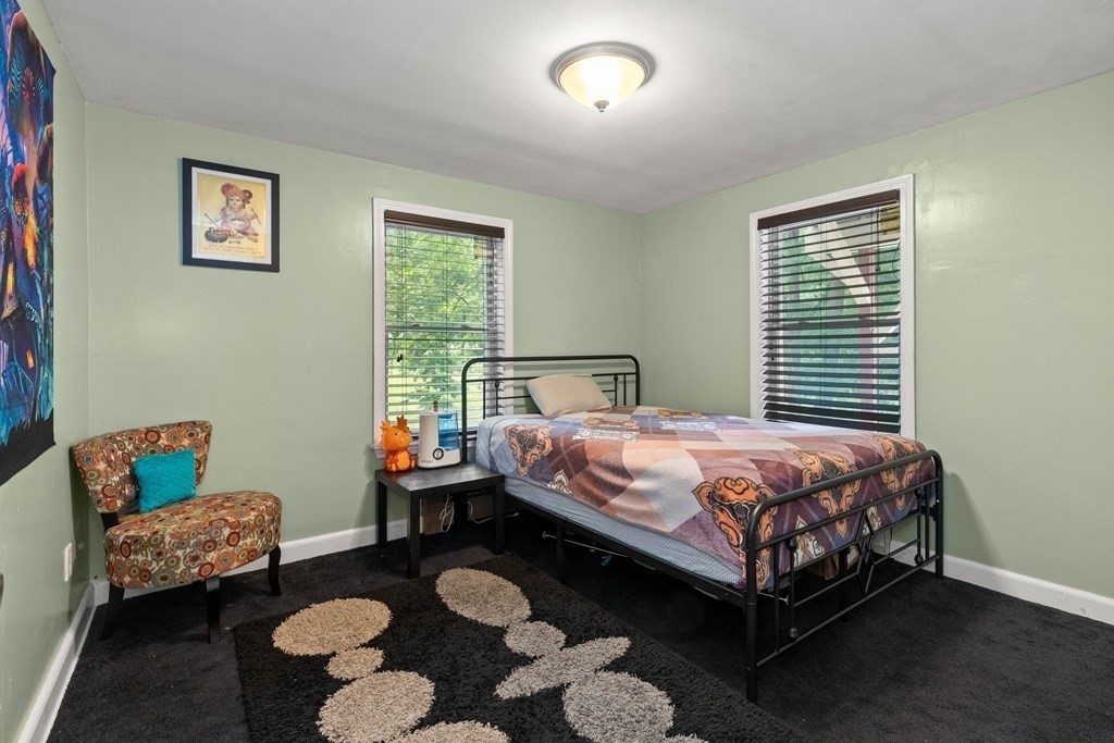 73 Baldwin Road Billerica, MA 01821 - Photo 25 of 40 a bed sitting in a bedroom next to a window