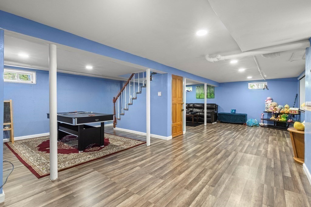 73 Baldwin Road Billerica, MA 01821 - Photo 29 of 40 a view of a livingroom with furniture and an empty room