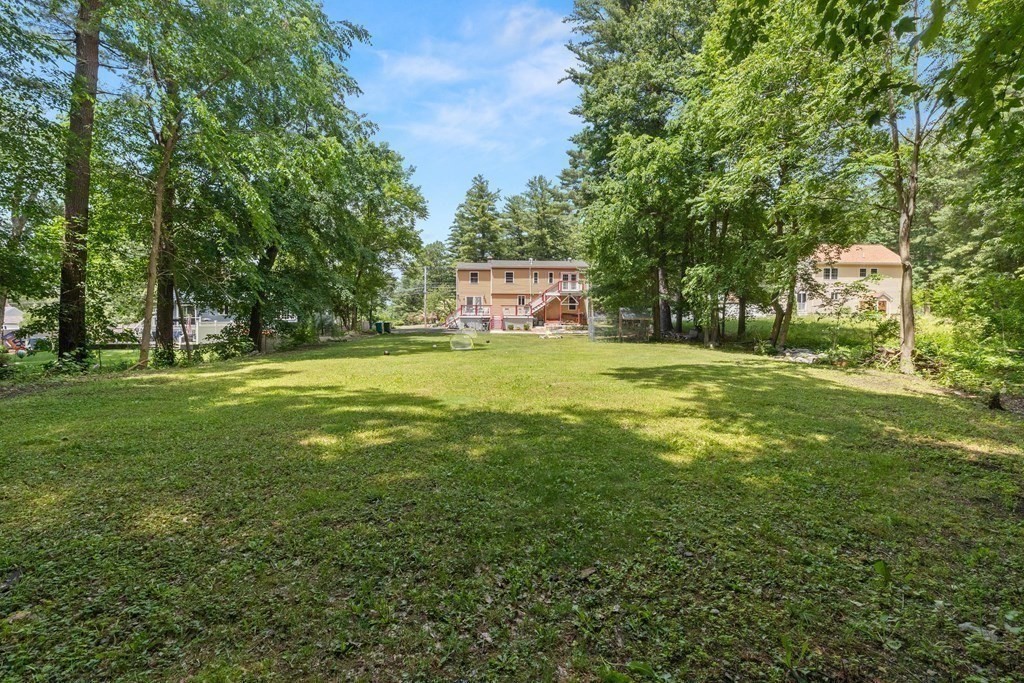 73 Baldwin Road Billerica, MA 01821 - Photo 36 of 40 a view of a trees with a big yard