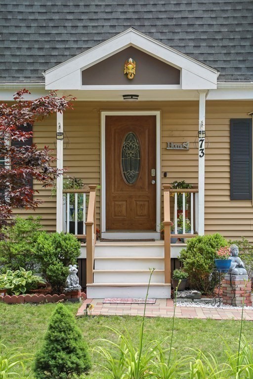 73 Baldwin Road Billerica, MA 01821 - Photo 37 of 40 a front view of a house with garden
