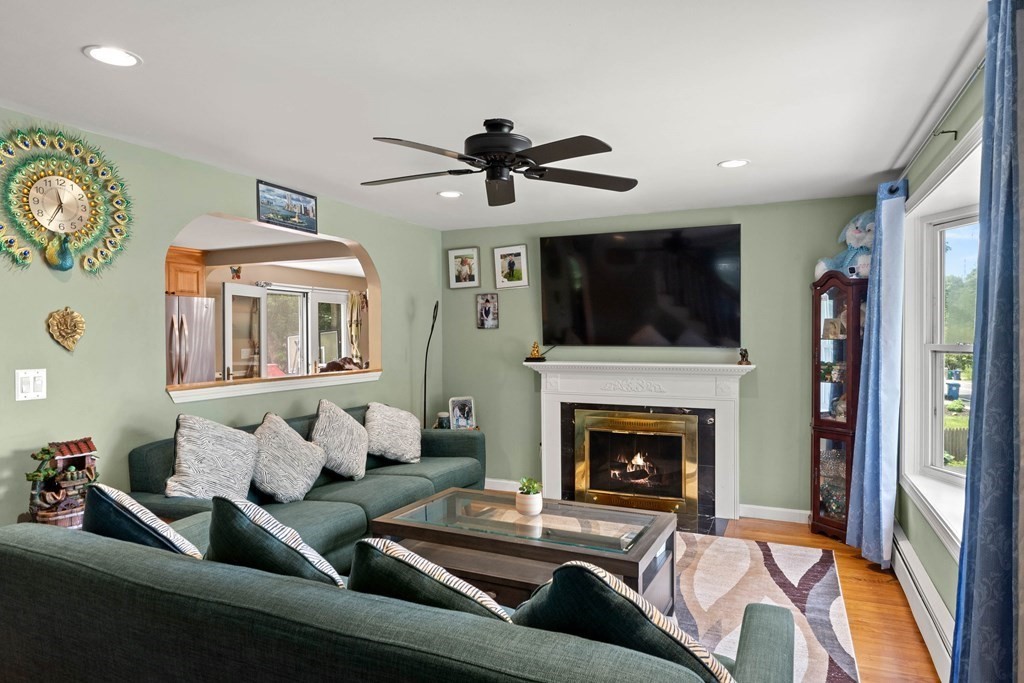 73 Baldwin Road Billerica, MA 01821 - Photo 6 of 40 a living room with furniture and a fireplace