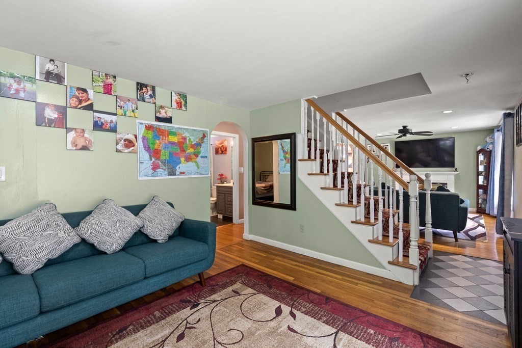 73 Baldwin Road Billerica, MA 01821 - Photo 8 of 40 a living room with furniture and stairs