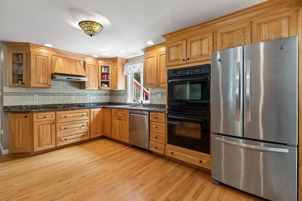 73 Baldwin Road Billerica, MA 01821 - Photo 10 of 40 a kitchen with stainless steel appliances a refrigerator stove and microwave
